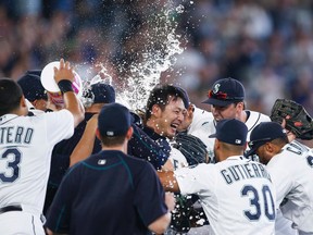 Mariners pitcher Hisashi Iwakuma (18) celebrates with teammates following the final out of his no-hit, 3-0 victory against the Orioles at Safeco Field in Seattle on Wednesday, Aug. 12, 2015. (Joe Nicholson/USA TODAY Sports)
