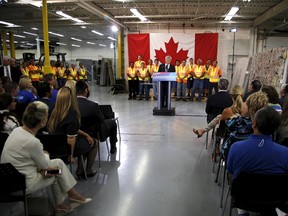 Canada's Prime Minister Stephen Harper speaks at a tile and stone manufacturing company in Toronto August 4, 2015. Harper said he would refrain from applying fresh taxes on the embattled energy sector and promised to bring back a home renovation tax credit. REUTERS/Chris Helgren