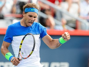 Rafael Nadal of Spain celebrates his victory against Sergiy Stakhovsky of Ukraine during Day 3 of the Rogers Cup in Montreal at Uniprix Stadium on August 12, 2015. (Minas Panagiotakis/Getty Images/AFP0