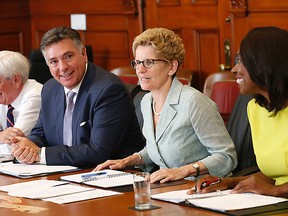 Premier Kathleen Wynne meets with the Ontario Pension Plan advisory group before speaking to media at Queen's Park on June 26, 2014. (Michael Peake/Toronto Sun)