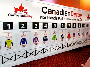 Scott Sinclair, senior manager of business planning & development at Northlands, updates the board during the Canadian Derby post-position draw Wedensday at the track. (Tom Braid, Edmonton Sun)