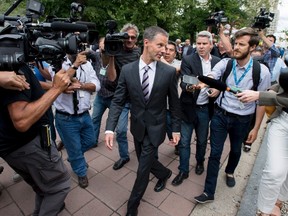Nigel Wright, former Chief of Staff to Prime Minister Stephen Harper, leaves the courthouse in Ottawa after his first day of testimony in the trial of former Conservative Senator Mike Duffy on Wednesday, Aug. 12, 2015. Duffy is facing 31 charges of fraud, breach of trust, bribery, frauds on the government related to inappropriate Senate expenses. THE CANADIAN PRESS/Justin Tang