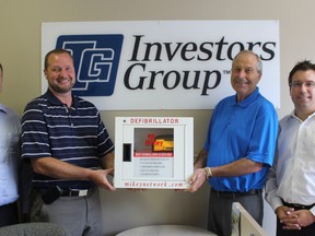 On August 10, the Investors Group received an automated external defibrillator for the Clinton location. Pictured here, from left, Gary Smith (insurance planning specialist), Paul Vandendool (consultant), Jake Deruyter (consultant) and Mark Stekar (regional director). Missing from the picture is Dwayne Laporte (consultant). (Laura Broadley Clinton News Record)