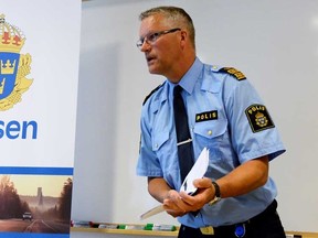 Vasteras police chief, Per Agren, speaks at a press conference, Tuesday Aug. 11, 2015. Police have revealed that the two suspects accused of killing a mother and her son at an Ikea store in Vasteras, north west of Stockholm, Monday, were from Eritrea and living at an asylum centre in the area. Police did not identify the suspects or the victims. (Anders Wiklund/TT via AP)