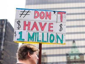 Demonstrators gather protesting against high housing prices for single family homes in downtown Vancouver, May 23, 2015. (REUTERS/Jim Jeong)