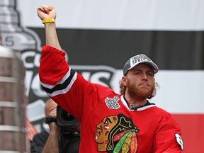 Patrick Kane of the Chicago Blackhawks gestures to the crowd during the Chicago Blackhawks Stanley Cup Championship Rally at Soldier Field on June 18, 2015. (Jonathan Daniel/Getty Images)