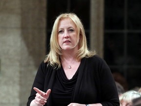 Transport Minister Lisa Raitt stands in the House of Commons during Question Period on Parliament Hill, Wednesday, June 17, 2015 in Ottawa.THE CANADIAN PRESS/Fred Chartrand