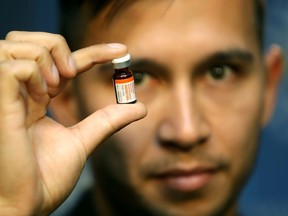 Dr. Nick Etches of Alberta Health Services holds up the antidote to fentanyl as the Calgary Police Service, Alberta Health Services and national law enforcement partners came together to again raise awareness about the increasing quantity and availability of fentanyl in Alberta in Calgary on Thursday August 13, 2015. Darren Makowichuk/Calgary Sun/Postmedia Network