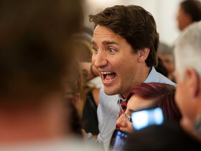 Liberal Leader Justin Trudeau poses for a photograph after speaking to supporters during a 2015 federal election campaign stop in Saskatoon, Sask., on Thursday, August 13, 2015. THE CANADIAN PRESS/Liam Richards