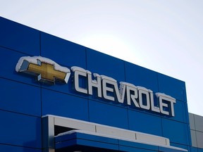 The sign at a Chevrolet General Motors store is seen at a dealer in Lakewood, Colorado February 6, 2014. (REUTERS/Rick Wilking)