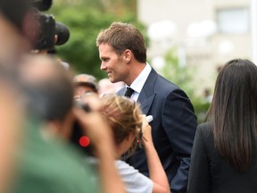 England Patriots quarterback Tom Brady leaves Federal District Courthouse in New York on August 12, 2015. (AFP PHOTO/DON EMMERT)