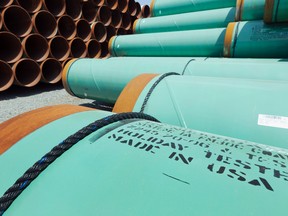 This May 24, 2012 file photo shows some of about 500 miles worth of coated steel pipe manufactured by Welspun Pipes, Inc., originally for the Keystone oil pipeline, stored in Little Rock, Ark. (AP Photo/Danny Johnston, File)