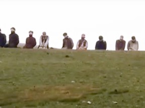 A scene from the latest ISIS video showing the execution of 10 prisoners by having them kneel above buried bombs that were then detonated. (Handout/Postmedia Network)