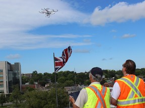 Samantha Reed/The Intelligencer
Paul Jeffs (left) and his son Robin (right) from PJ Materials Consultants Limited, work together to navigate and fly a drone on Thursday morning on the roof of Belleville's city hall. The drone was used during a routine inspection of the outside of the building. The drone is a safer and cheaper option to the bucket truck or lift that they normally use.