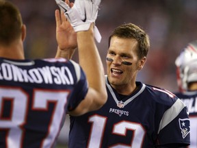 Patriots quarterback Tom Brady (12) and tight end Rob Gronkowski (87) react from the sideline after a touchdown against the Packers during NFL preseason action at Gillette Stadium in Foxborough, Mass., on Thursday, Aug. 13, 2015. (David Butler II/USA TODAY Sports)