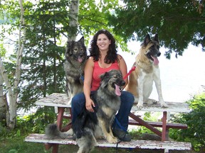 Photo supplied
Nicole Charbonneau of Timmins hangs out with canine pals Guru, right, a husky/malamute; Lushia, left, an American Akita; and Jiggers, front, a Great Pyrenees mix. A graduate of plant ecology and land reclamation at Laurentian, Charbonneau advocates the use of Karelian dogs to harrass and herd black bears out of communities and work camps where they are causing problems.