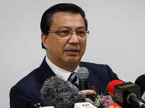 Malaysian Transport Minister Liow Tiong Lai speaks at a special press conference on the Malaysia Airlines Flight MH370 and MH17 at an unrelated event in Shah Alam, Malaysia Wednesday, Aug. 12, 2015.  (AP Photo/Joshua Paul)