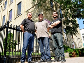 Fire Roasted Coffee employees Mark Beacock (left), and Mark Kovacs (right), flank owner David Cook outside the company’s new location at 630 Dundas Street in London Ont. August 13, 2015. Currently being renovated through private investment, Cook said the century-old building in Old East Village will also have space to incubate local small businesses in the food industry. CHRIS MONTANINI\LONDONER\POSTMEDIA NETWORK
