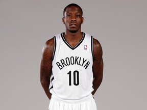 In this Sept. 30, 2013, file photo, Tyshawn Taylor poses during the Brooklyn Nets media day at the Barclay's Center in New York. (AP Photo/Richard Drew, File)