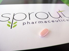 A tablet of flibanserin sits on a brochure for Sprout Pharmaceuticals in the company's Raleigh, N.C., headquarters. Sprout soon may succeed where many of the world’s largest pharmaceutical companies have failed: in winning Food and Drug Administration approval for flibanserin, dubbed Addyi, the first drug to boost women’s sexual desire. (AP Photo/Allen G. Breed)