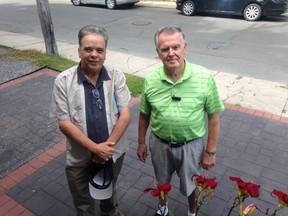 City councillor Jim Neill with Terry Price, who has had a long-standing feud with the city about front yard parking at his Victoria Street home. Paul Schliesmann/The Whig-Standard
