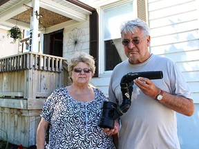 Sandy and Bob Sauve show a piece of pipe they say rats chewed through to gain access to their Mitton Street home. A local pest control company says rat infestations have been on the rise in Sarnia-Lambton. Tyler Kula/Sarnia Observer/Postmedia Network