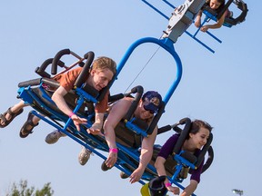 INTELLIGENCER FILE PHOTO BY TIM MILLER
Festival goers fly through the air on one of the many rides at the Waterfront Ethnic Festival midway on Saturday July 11. Events such as the festival are part of the reason tourism numbers are up this year, officials say.