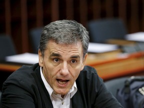 Greek Finance Minister Euclid Tsakalotos attends a euro zone finance ministers meeting in Brussels, Belgium, Aug. 14, 2015.  REUTERS/Francois Lenoir