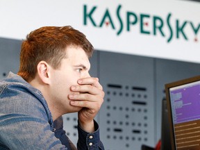 An employee works near screens in the virus lab at the headquarters of Russian cyber security company Kaspersky Labs in Moscow July 29, 2013. REUTERS/Sergei Karpukhin