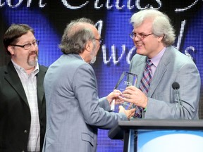 Bill Harris of The Toronto Sun presents the Career Achievement Award to director James L. Brooks onstage during the 31st annual Television Critics Association Awards at The Beverly Hilton Hotel on August 8, 2015 in Beverly Hills, California.  (Frederick M. Brown/AFP)