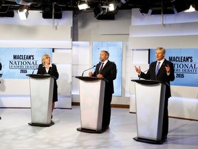 Liberal leader Justin Trudeau (L), Green Party leader Elizabeth May (2nd L) and New Democratic Party leader Thomas Mulcair listen as Conservative Leader Stephen Harper (R) speaks during the first leaders' debate in Toronto August 6, 2015. The leaders answered questions on the economy and tax policy, foreign affairs and Canada’s role in the world, energy and the environment, plus, Canada’s democratic institutions. REUTERS/Mark Blinch