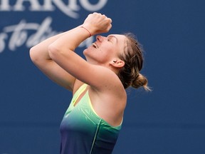 Simona Halep reacts after defeating Agnieszka Radwanska during Rogers Cup quarterfinal action in Toronto on Friday, Aug. 14, 2015. (Darren Calabrese/THE CANADIAN PRESS)