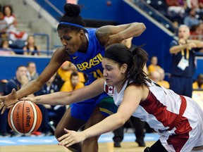 Jul 19, 2015; Toronto, Ontario, CAN; Canada center Natalie Achonwa (11) and Brazil forward Isabela Macedo (14) go after a loose ball in the women's semifinal game during the 2015 Pan Am Games at Ryerson Athletic Centre. Mandatory Credit: John David Mercer-USA TODAY Sports