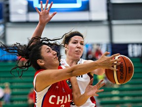 Canada's Katherine Plouffe blocks Chile's Marisol Gamboa during this FIBA Americas tournament (Codie McLachlan, Edmonton Sun).