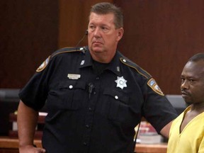 David Conley exits the 183rd District Criminal Courtroom after his arraignment in Houston, Texas August 10, 2015. Conley has been charged with capital murder after a family of six children, one of them his own son, and two adults were found shot to death in a house in Houston, officials said on Sunday.  REUTERS/Daniel Kramer