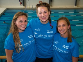 Competitive swimmers Katelyn Dickey, Aitana Robinson and Tessa Peerless organized a charity swim-a-thon to raise money for an exercise program for children with disabilities. (DEREK RUTTAN, The London Free Press)