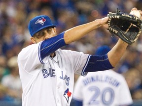 Blue Jays starting pitcher David Price wipes his brow during third inning MLB action against the Yankees in Toronto on Friday, Aug. 14, 2015. (Fred Thornhill/THE CANADIAN PRESS)