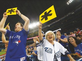 A couple of Blue Jays fans heckle Yankees’ Alex Rodriguez during last night’s game at the Rogers Centre. These two likely remember the previous Jays pennant chase back in 1993, but our Bob Elliott has some advice for those who don’t. (STAN BEHAL, Toronto Sun)
