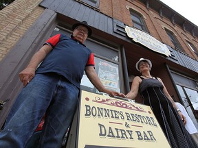 Wayne Boyle, owner of Bonnie’s Restore and Dairy Bar stands with his common-law partner Barbara Isaac in front of the second-hand store that must move to a new location.(Shaun Gregory/Huron Expositor)