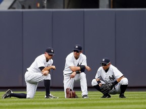 The stolen base totals of Yankees leadoff hitters Jacoby Ellsbury (left) and Brett Gardner have taken a hit since the team's sluggers began heating up. (AFP)