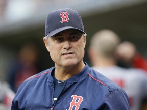 Boston Red Sox manager John Farrell watches from the dugout during the first inning against the Detroit Tigers earlier this season. (AP Photo/Carlos Osorio, File)