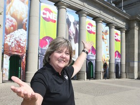 Virginia Ludy in front of the CNE Princes Gates on Aug. 13, 2015. (Veronica Henri/Toronto Sun)