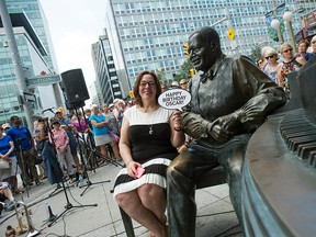 Kelly Peterson sits with the statue of her late husband and Canadian jazz musician Oscar Peterson Saturday, Aug. 15, 2015 in front of the National Arts Centre (NAC). The NAC celebrated what would be Oscar's 90th birthday.
DANI-ELLE DUBE/Ottawa Sun