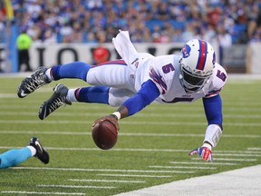 Buffalo Bills quarterback Tyrod Taylor dives for the first-down marker during NFL preseason play against the Carolina Panthers on Friday, Aug. 14, 2015, in Orchard Park, N.Y. (AP Photo/Bill Wippert)