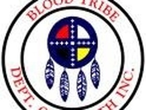 Flames engulfed the Red Crow College building early Friday. Blood tribe health department logo.