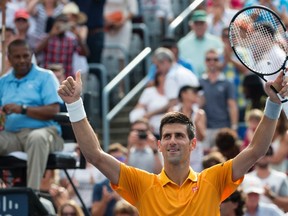 Novak Djokovic, of Serbia, celebrates his victory over Jeremy Chardy, of France, during the semifinals at the Rogers Cup tennis tournament on Saturday, August 15, 2015 in Montreal. Djokovic won 6-4, 6-4 to move on to the final. THE CANADIAN PRESS/Paul Chiasson