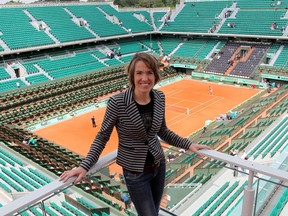 Former tennis player Justine Henin of Belgium poses overlooking the Philippe Chartrier court at the Roland Garros stadium in Paris June 5, 2012.  (REUTERS/Francois Lenoir)