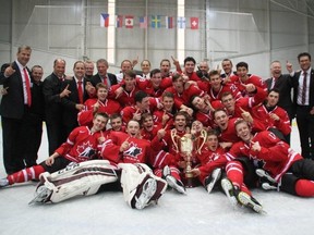 Canadian players and staff celebrate after beating Sweden in the final of the Ivan Hlinka tournament Saturday in the Czech Republic. (Hockey Canada photo)