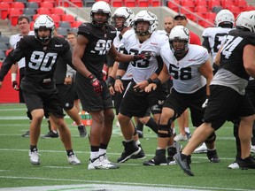 Alex Mateas (56) has been working hard in practice, listening to any advice from his coaches and offensive line teammates.
TIM BAINES/OTTAWA SUN