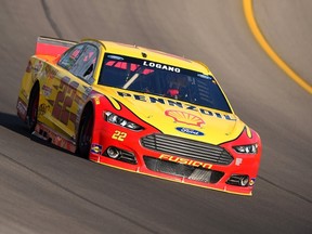 Joey Logano drives his No. 22 Shell Pennzoil Ford around the Michigan International Speedway track during practice Saturday for the Pure Michigan 400. (Getty Images/AFP)